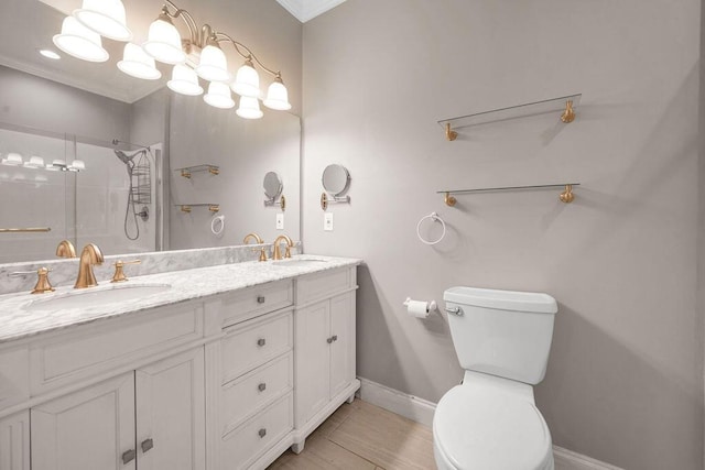 5820 Trion Teloga Rd, Summerville, GA 30747 - full bathroom with double vanity, a shower with shower door, baseboards, toilet, and ornamental molding