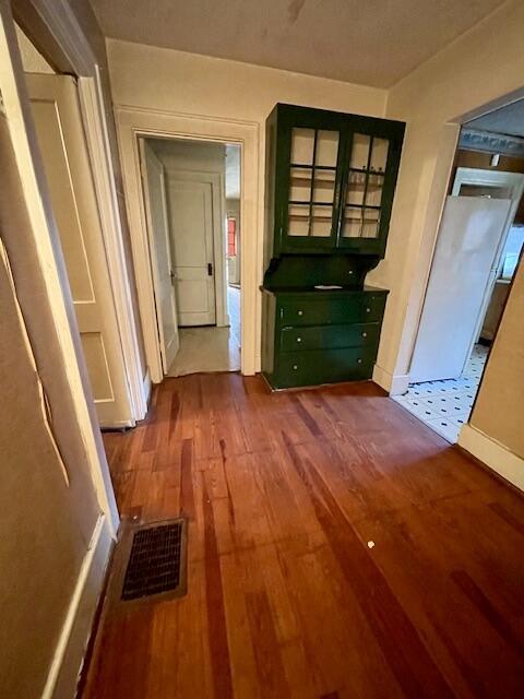 4908 13th Ave, Chattanooga, TN 37407 - corridor featuring dark wood-style flooring and baseboards