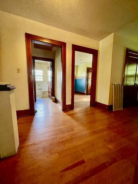 4908 13th Ave, Chattanooga, TN 37407 - hall with wood finished floors and a textured ceiling