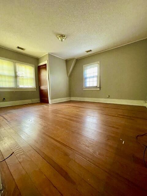 4908 13th Ave, Chattanooga, TN 37407 - unfurnished room featuring hardwood / wood-style flooring and a textured ceiling
