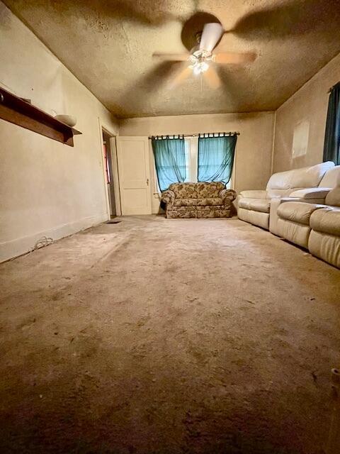 4908 13th Ave, Chattanooga, TN 37407 - living area featuring carpet, a ceiling fan, and a textured ceiling