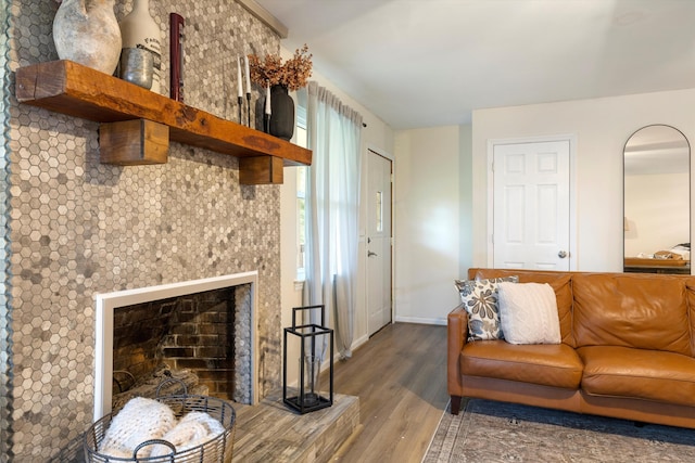 142 Holli Bird Ln, Ringgold, GA 30736 - living area with wood finished floors, baseboards, and a fireplace