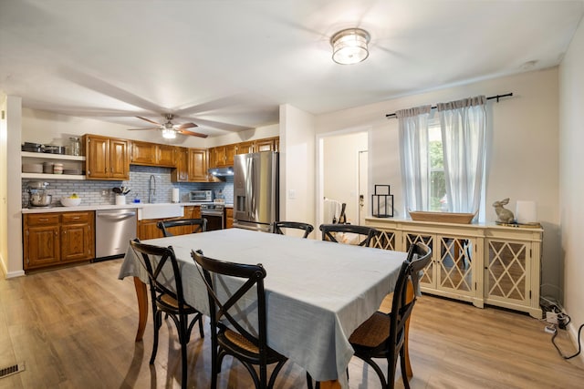 142 Holli Bird Ln, Ringgold, GA 30736 - dining space featuring light wood-style flooring and ceiling fan