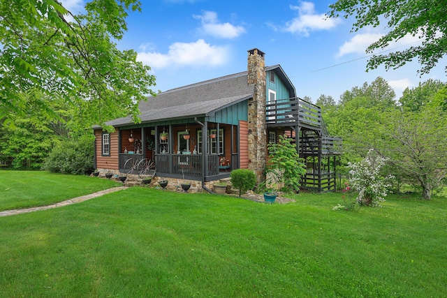 4306 Fredonia Rd, Dunlap, TN 37327 - view of front facade with a front lawn, a chimney, a deck, stairs, and board and batten siding