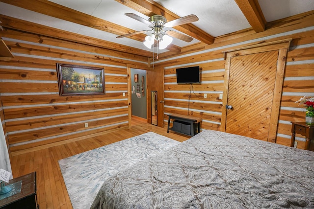 4306 Fredonia Rd, Dunlap, TN 37327 - bedroom with beamed ceiling, wooden walls, and hardwood / wood-style flooring