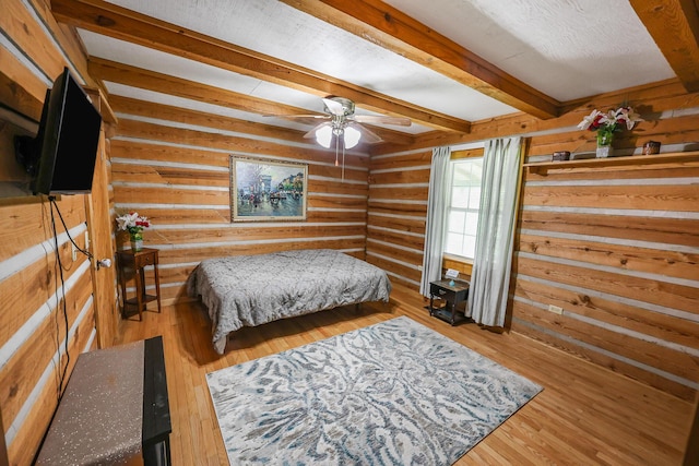 4306 Fredonia Rd, Dunlap, TN 37327 - bedroom featuring beam ceiling, wood finished floors, and log walls