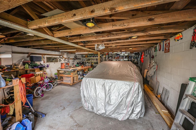 4306 Fredonia Rd, Dunlap, TN 37327 - garage with a workshop area and concrete block wall