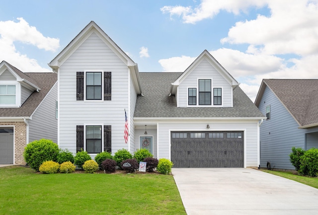8647 Kensley Ln, Hixson, TN 37343 - traditional-style home with concrete driveway, a front yard, and roof with shingles