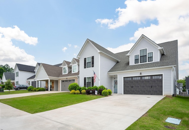 8647 Kensley Ln, Hixson, TN 37343 - view of front of home with concrete driveway, a front lawn, and a shingled roof