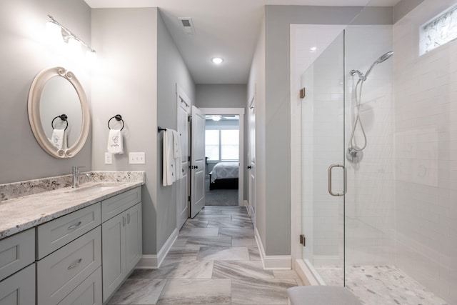 8647 Kensley Ln, Hixson, TN 37343 - ensuite bathroom featuring a shower stall, baseboards, vanity, and recessed lighting