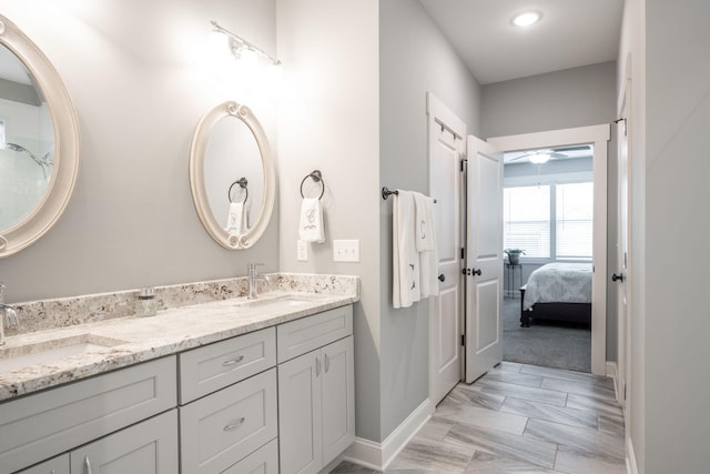 8647 Kensley Ln, Hixson, TN 37343 - full bath featuring baseboards, marble finish floors, a ceiling fan, and double vanity