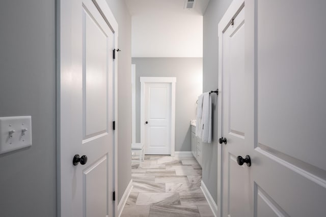 8647 Kensley Ln, Hixson, TN 37343 - hallway featuring light marble finish flooring and baseboards