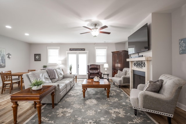 8647 Kensley Ln, Hixson, TN 37343 - living room featuring wood finished floors, ceiling fan, baseboards, a fireplace, and recessed lighting