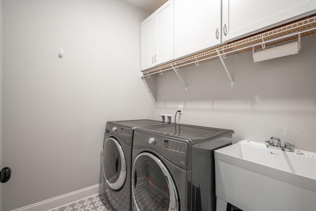 8647 Kensley Ln, Hixson, TN 37343 - clothes washing area with cabinet space, independent washer and dryer, and baseboards