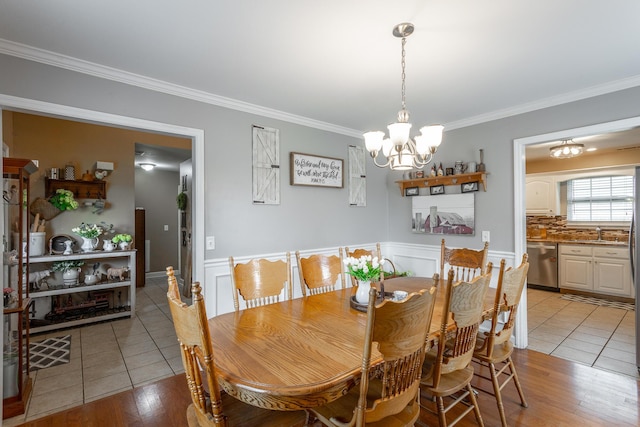 647 Peachtree Cir, Ringgold, GA 30736 - dining room with ornamental molding, a chandelier, light tile patterned floors, and wainscoting