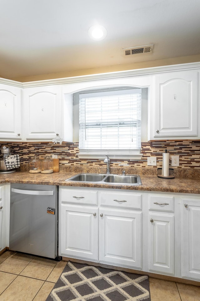 647 Peachtree Cir, Ringgold, GA 30736 - kitchen with stainless steel dishwasher, a sink, light tile patterned floors, and tasteful backsplash