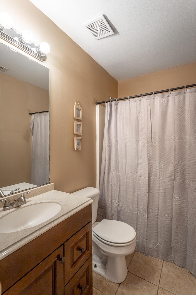 647 Peachtree Cir, Ringgold, GA 30736 - bathroom featuring vanity, toilet, and tile patterned flooring