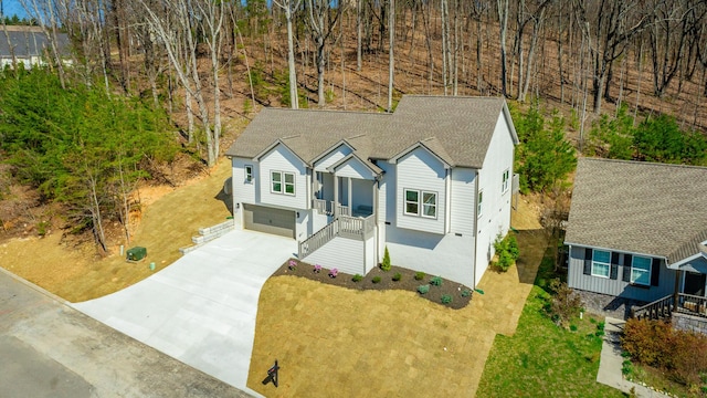 1384 Unity Dr NE, Cleveland, TN 37312 - view of front facade featuring driveway, a garage, and a shingled roof