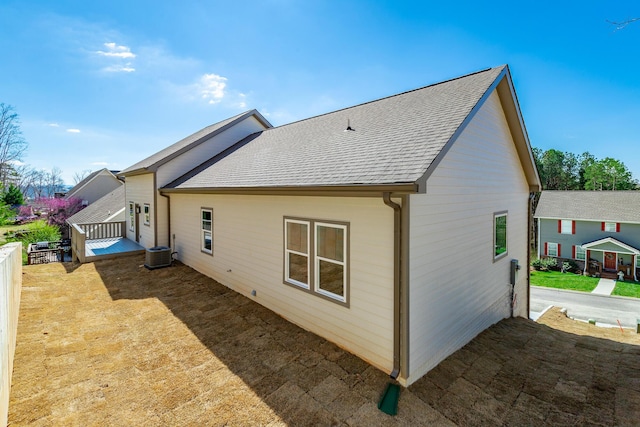 1384 Unity Dr NE, Cleveland, TN 37312 - rear view of property featuring central AC unit and a shingled roof