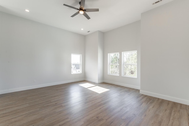 1384 Unity Dr NE, Cleveland, TN 37312 - spare room with a ceiling fan, baseboards, recessed lighting, wood finished floors, and a high ceiling
