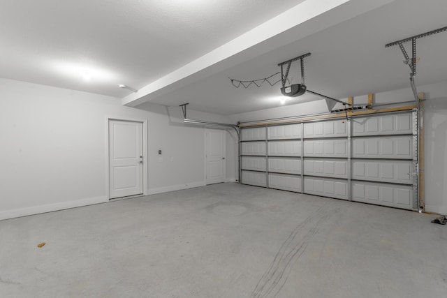 1384 Unity Dr NE, Cleveland, TN 37312 - garage featuring a garage door opener and baseboards