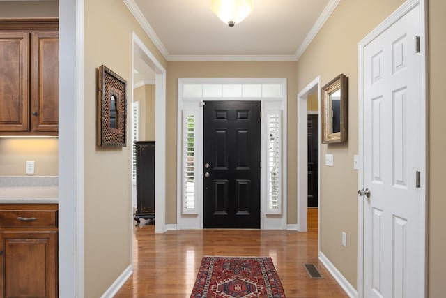 6063 Heritage Ridge Dr, Hixson, TN 37343 - entryway with light wood-style floors, ornamental molding, and baseboards
