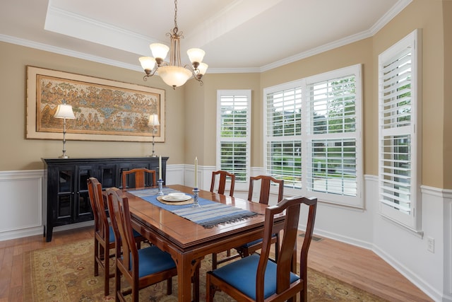 6063 Heritage Ridge Dr, Hixson, TN 37343 - dining area featuring light wood finished floors, a chandelier, ornamental molding, and a wainscoted wall