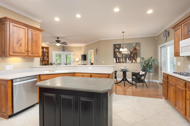 6063 Heritage Ridge Dr, Hixson, TN 37343 - kitchen featuring white appliances, a sink, a peninsula, recessed lighting, and brown cabinets