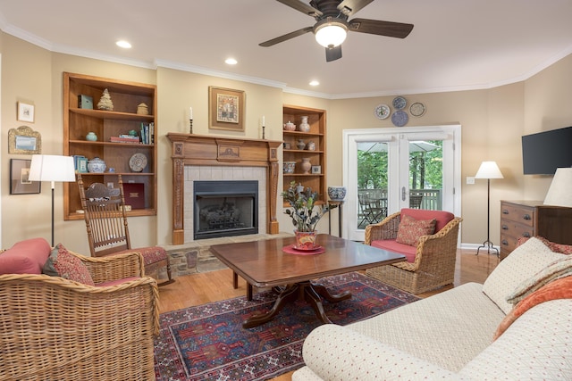 6063 Heritage Ridge Dr, Hixson, TN 37343 - living area with wood finished floors, ceiling fan, a fireplace, crown molding, and recessed lighting