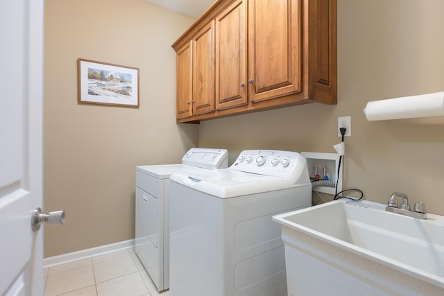 6063 Heritage Ridge Dr, Hixson, TN 37343 - washroom with cabinet space, independent washer and dryer, light tile patterned flooring, and baseboards