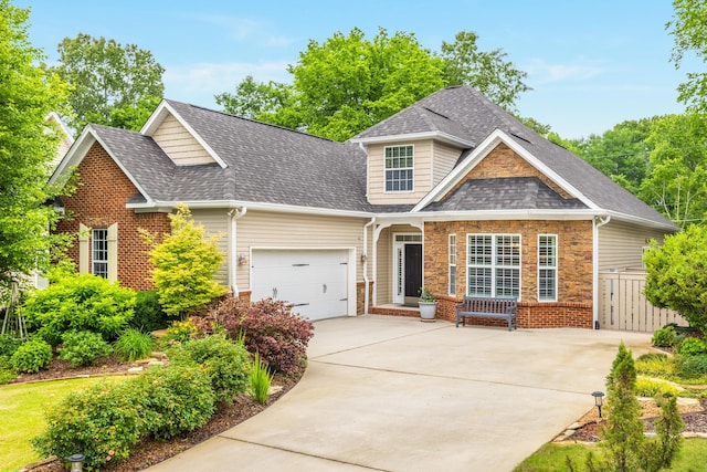 6063 Heritage Ridge Dr, Hixson, TN 37343 - view of front of house featuring concrete driveway, roof with shingles, an attached garage, and stone siding
