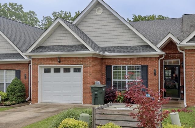 1008 Grey Oaks Ln, Chattanooga, TN 37421 - view of front of property featuring an attached garage, concrete driveway, a shingled roof, and brick siding