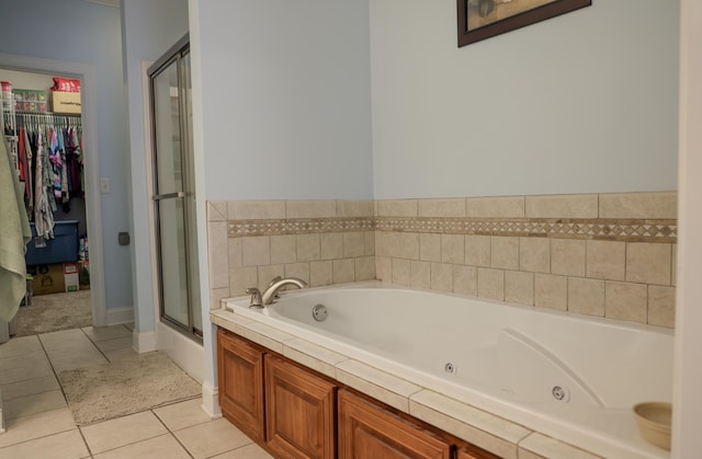 1008 Grey Oaks Ln, Chattanooga, TN 37421 - full bath with a jetted tub, a stall shower, tile patterned floors, and a spacious closet