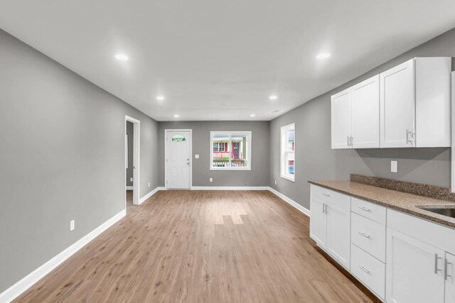1904 Sharp St, Chattanooga, TN 37404 - kitchen with light wood finished floors, recessed lighting, white cabinetry, and baseboards