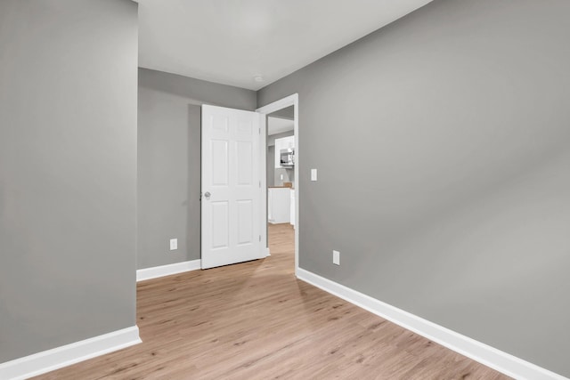 1904 Sharp St, Chattanooga, TN 37404 - unfurnished bedroom with baseboards and light wood finished floors
