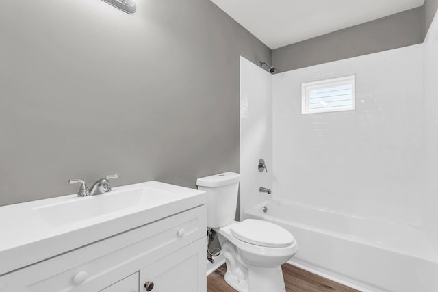 1904 Sharp St, Chattanooga, TN 37404 - full bath with wood finished floors, toilet, vanity, and shower / washtub combination