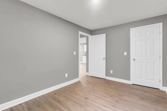 1904 Sharp St, Chattanooga, TN 37404 - unfurnished bedroom featuring baseboards and light wood-style flooring
