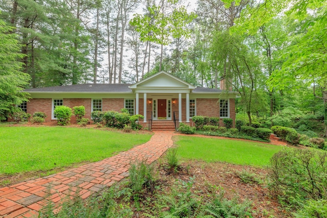 302 Brookwood Ln, Lafayette, GA 30728 - neoclassical home featuring brick siding, a front lawn, and a chimney