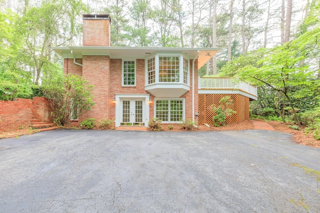 302 Brookwood Ln, Lafayette, GA 30728 - view of front of property with french doors, a chimney, and brick siding