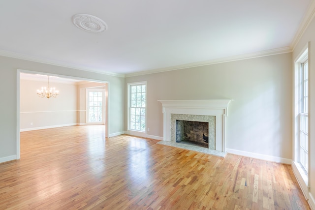 302 Brookwood Ln, Lafayette, GA 30728 - unfurnished living room featuring a chandelier, light wood finished floors, ornamental molding, a premium fireplace, and baseboards