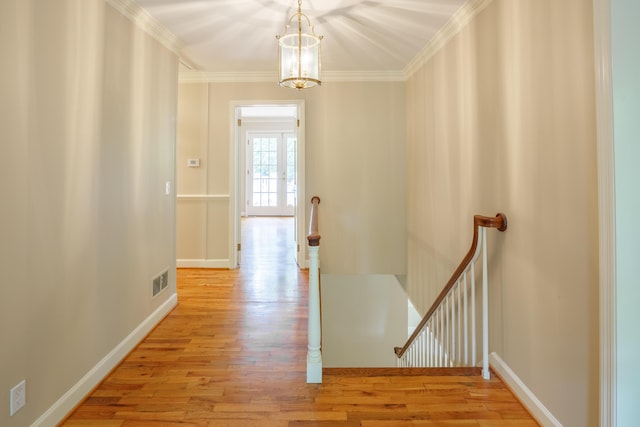 302 Brookwood Ln, Lafayette, GA 30728 - corridor featuring an upstairs landing, light wood-style flooring, crown molding, a chandelier, and baseboards
