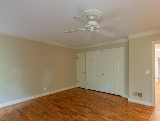 302 Brookwood Ln, Lafayette, GA 30728 - unfurnished bedroom featuring crown molding, wood finished floors, baseboards, a closet, and ceiling fan