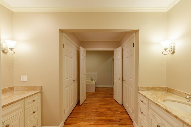302 Brookwood Ln, Lafayette, GA 30728 - full bathroom with wood finished floors, vanity, ornamental molding, a bath, and baseboards