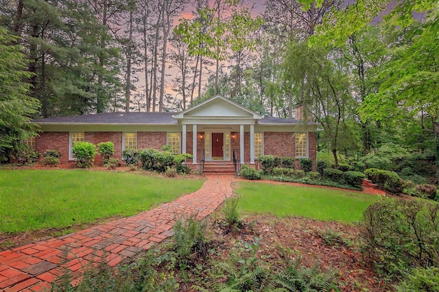 302 Brookwood Ln, Lafayette, GA 30728 - greek revival house featuring a front lawn, brick siding, a chimney, and a porch