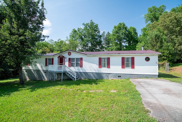 230 Appaloosa Dr, Tunnel Hill, GA 30755 - manufactured / mobile home with a front yard, crawl space, and metal roof