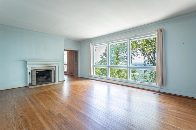 1613 Fairy Dell Trl, Lookout Mountain, GA 30750 - unfurnished living room featuring hardwood / wood-style flooring, a fireplace with flush hearth, ornamental molding, and baseboards
