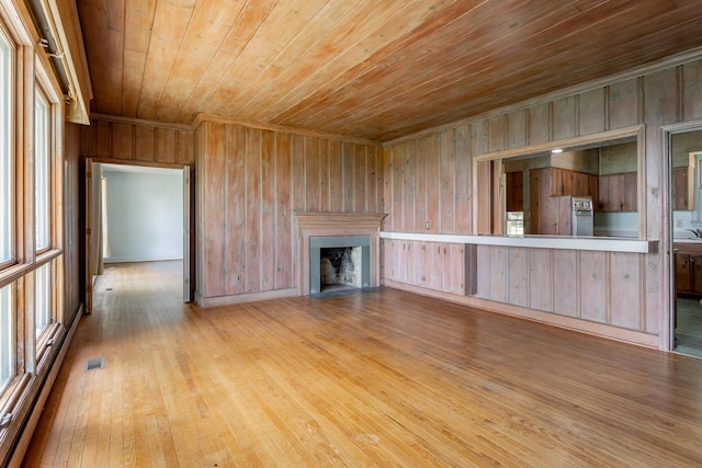 1613 Fairy Dell Trl, Lookout Mountain, GA 30750 - unfurnished living room with wooden ceiling, wood walls, wood finished floors, a fireplace with flush hearth, and crown molding