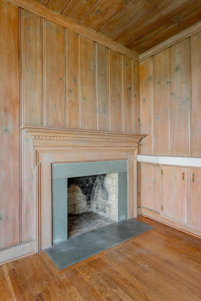 1613 Fairy Dell Trl, Lookout Mountain, GA 30750 - detailed view of wooden ceiling, a fireplace with flush hearth, wood finished floors, and wood walls