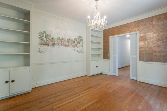 1613 Fairy Dell Trl, Lookout Mountain, GA 30750 - unfurnished dining area with a chandelier, wood finished floors, crown molding, built in shelves, and wainscoting