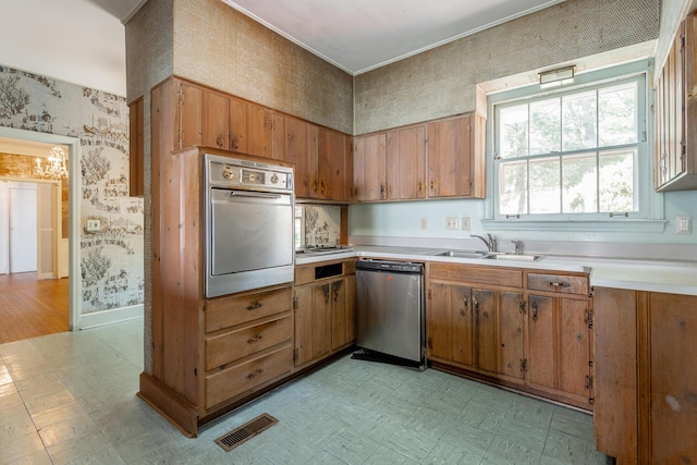 1613 Fairy Dell Trl, Lookout Mountain, GA 30750 - kitchen with appliances with stainless steel finishes, wallpapered walls, a sink, light flooring, and brown cabinetry